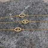Gold bracelet with stone eye and zircons