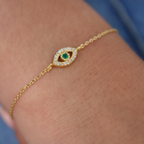 Gold bracelet with stone eye and zircons