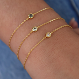 Golden bracelet with small natural stone