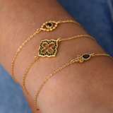 Gold bracelet and arabesque flower