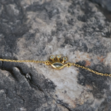 Gold crown bracelet with stone and zircons