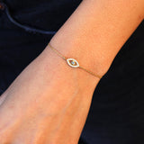 Openwork eye bracelet with stone and zircons