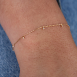 Gold bracelet with diamond tassels