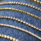 Gold tennis bracelet with 2mm zircons