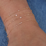 Gold bracelet and diamond bar