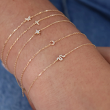 Gold and diamond cross bracelet