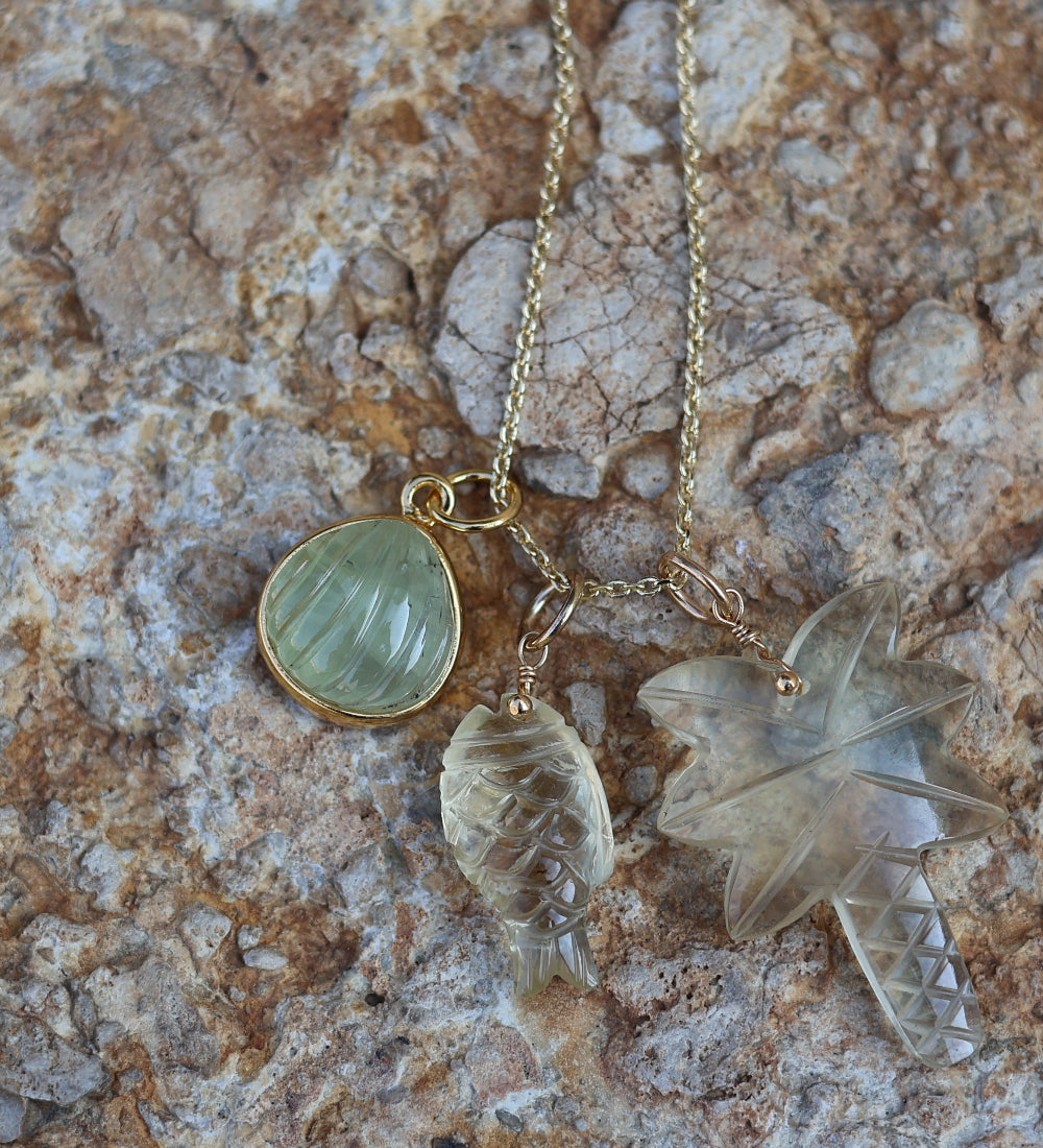 Gold necklace and natural stone palm tree