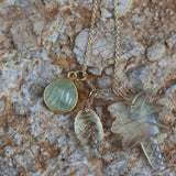 Gold necklace and natural stone palm tree