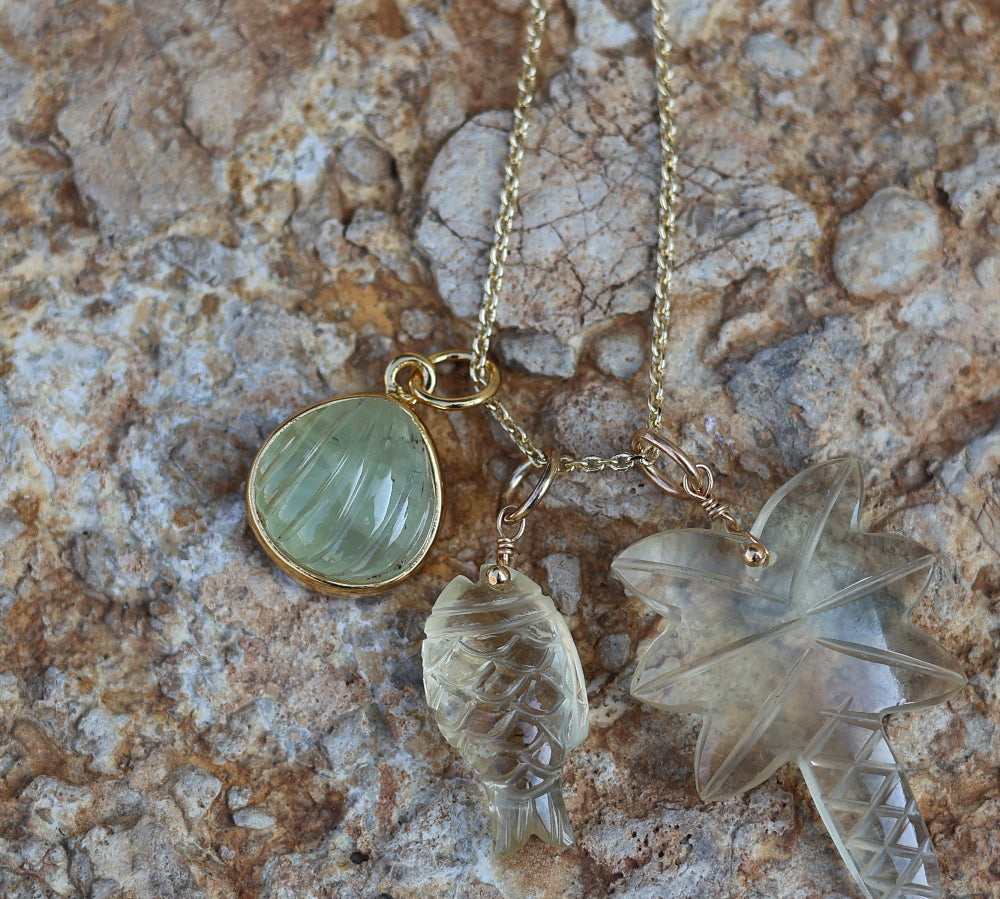 Gold necklace and natural stone palm tree