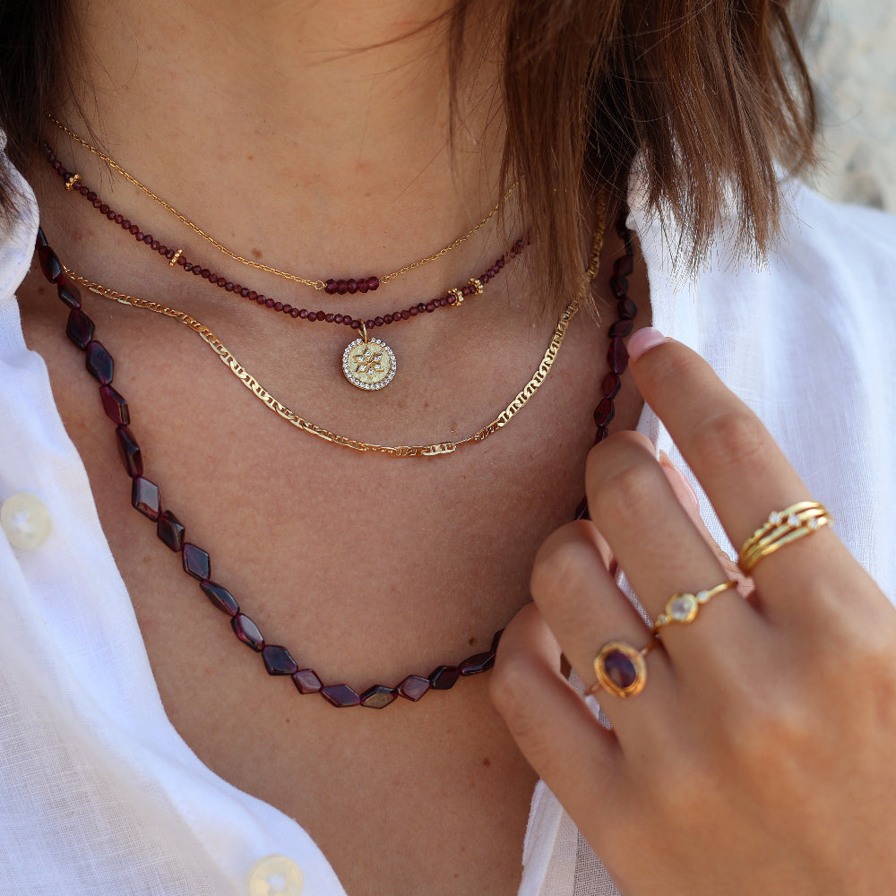 Gold choker with small natural stones