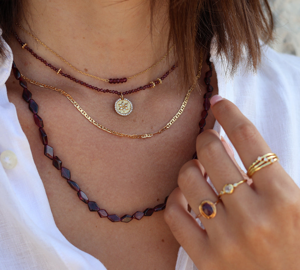 Gold choker with small natural stones