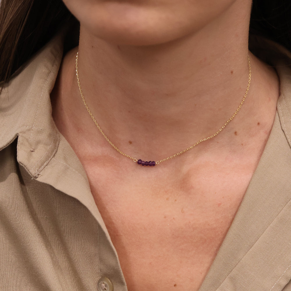 Gold choker with small natural stones