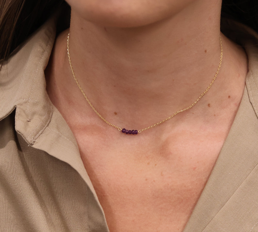 Gold choker with small natural stones