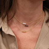 Gold choker with small natural stones