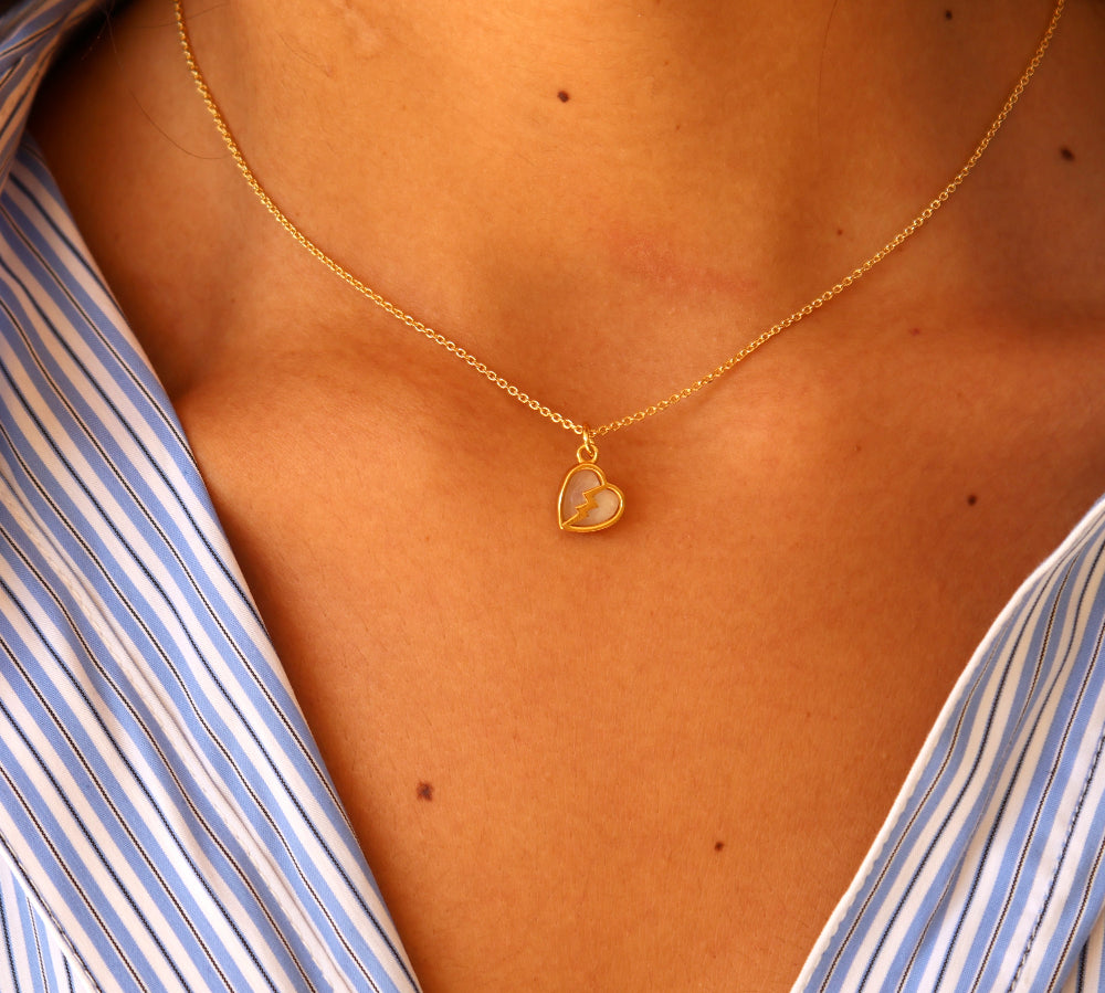 Gold broken heart and stone necklace