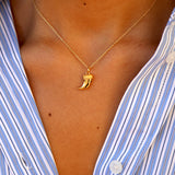 Golden necklace pendant cornucopia