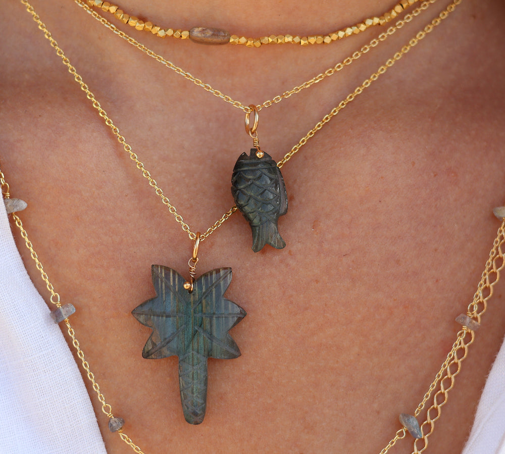 Gold necklace and natural stone fish