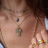 Gold necklace with baroque cross pendant and stones