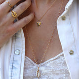 Gold shark tooth and stone necklace