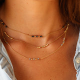 Gold necklace with cultured stones and gold pearls