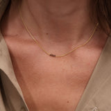 Gold choker with small natural stones
