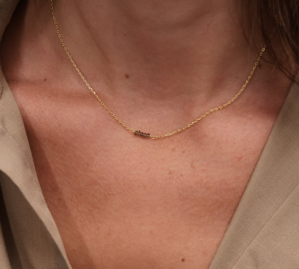 Gold choker with small natural stones
