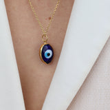 Golden necklace with blown glass eye