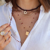 Golden necklace with square raw stones