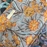 Large gray travel pouch with orange flowers