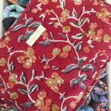 Large red travel pouch with yellow and orange flowers