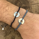 Colored cord bracelet and hammered hole piece