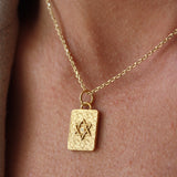 Gold necklace with star of David and zircon