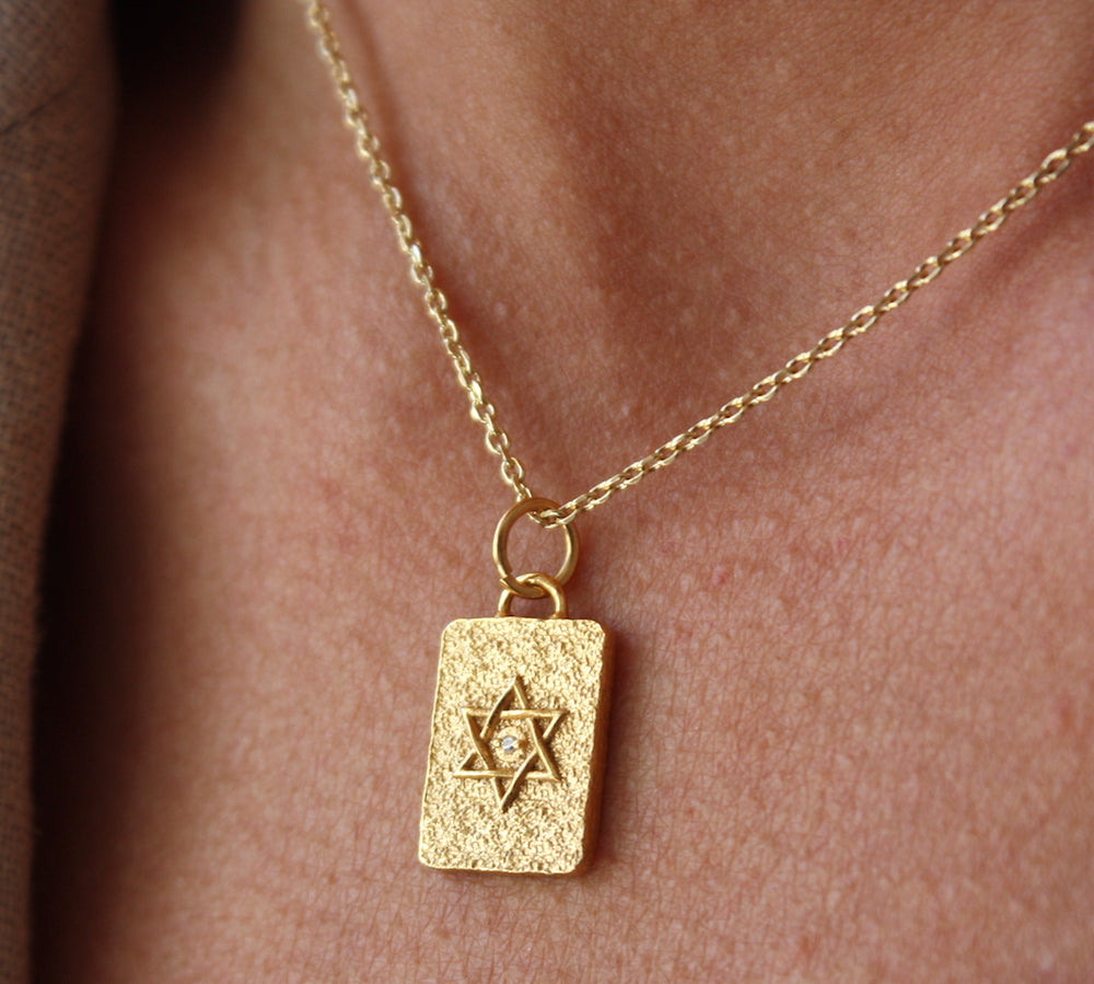 Gold necklace with star of David and zircon