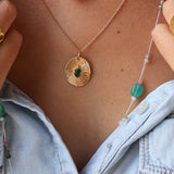 Gold necklace and striated and stone pendant