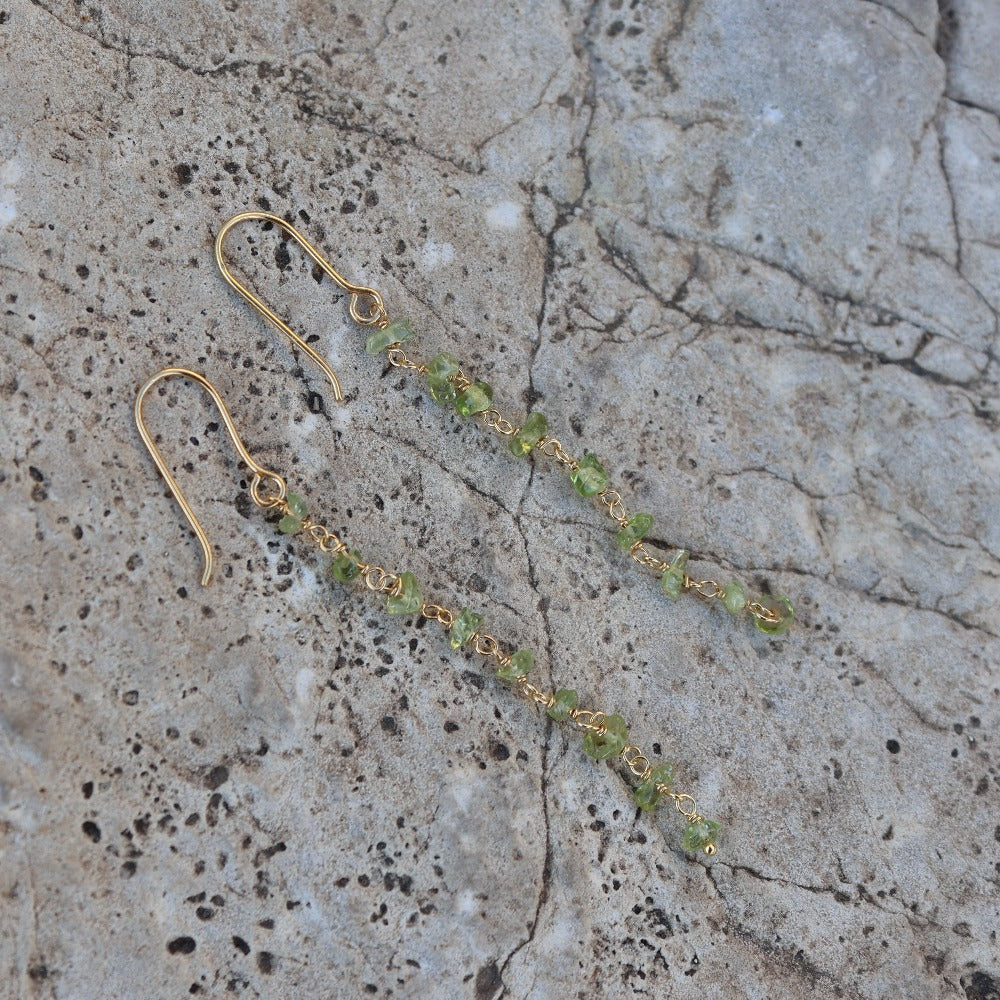 Golden earrings and raw stones