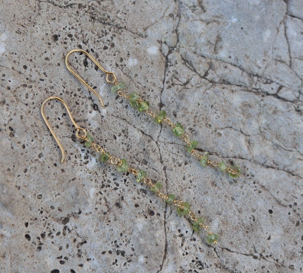 Golden earrings and raw stones