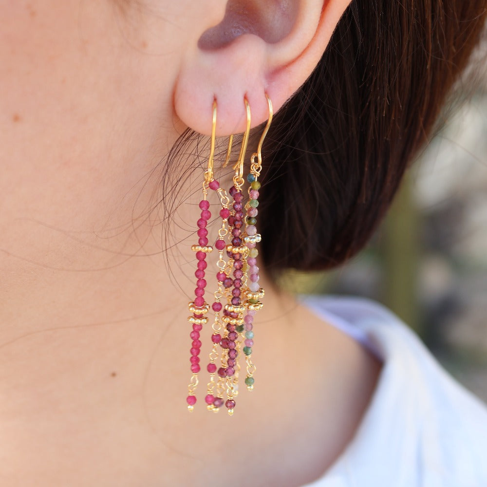 Golden hanging earrings with stones