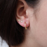 Mini gold hoop earrings with diamond-shaped zircons