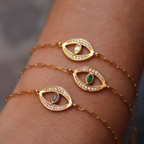 Bracelet doré oeil porte bonheur pierre et zircons