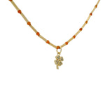 Collier doré tubes avec onyx rouge et trèfle zircons blancs 40cm
