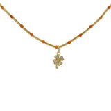 Collier doré tubes avec onyx rouge et trèfle zircons blancs 40cm