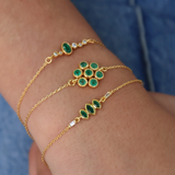 Gold bracelet and stone flower