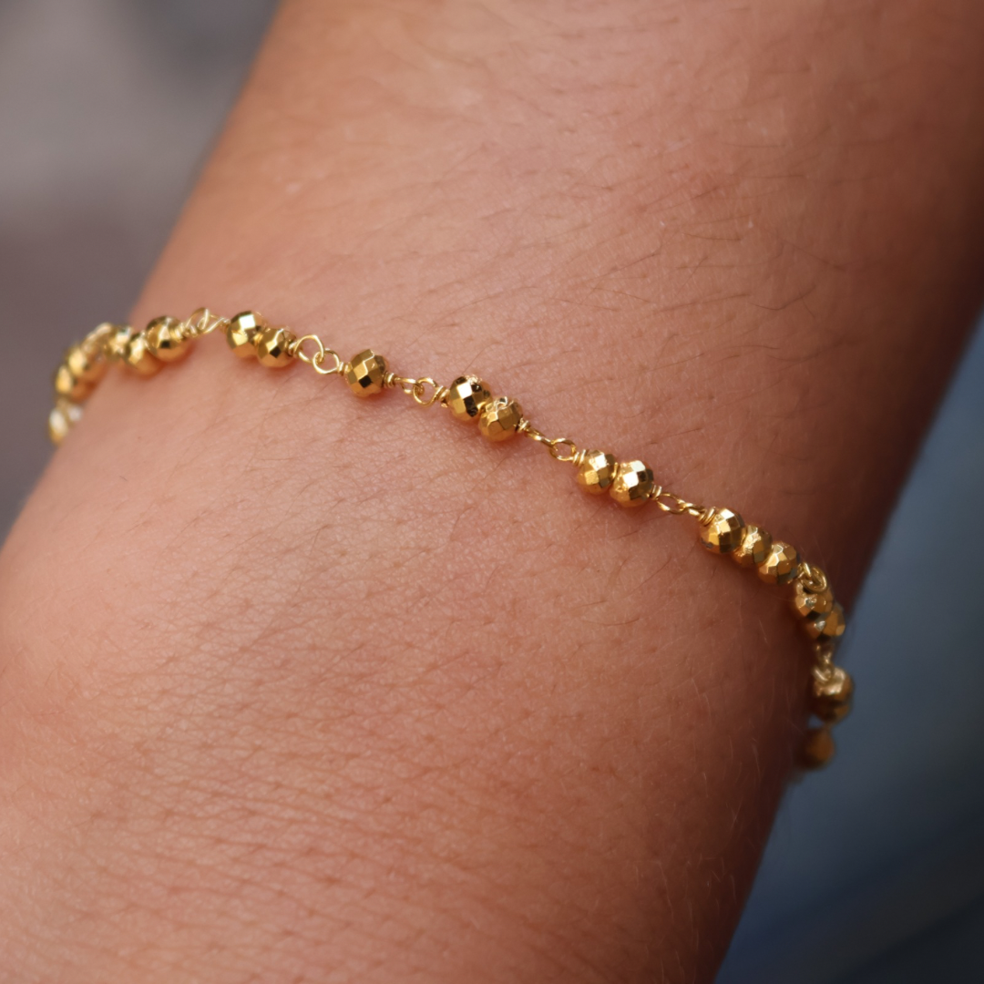 Gold bracelet with small stones