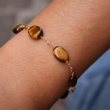 Golden bracelet with oval stones and small stones