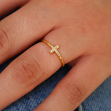 Gold ring and small zircon cross