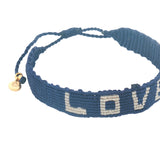 Bracelet brésilien doré fil tissé bleu marine et crème "love"
