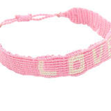 Bracelet brésilien doré fil tissé rose et crème "love"