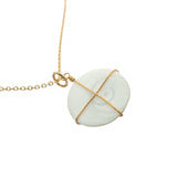 Large golden necklace with Saint Lucia's eye shell and golden thread