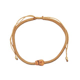 Bracelet cordon doré tête de mort beige