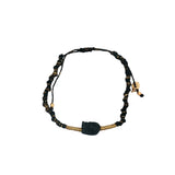 Bracelet doré cordon tressé noir et doré avec tête de mort noire
